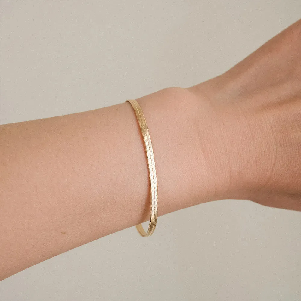 Trending Elegance: Women's Classic Snake Chain Bracelet in Gold Color, available in widths of 3/4/5MM. Crafted from Stainless Steel, this bracelet is a timeless and stylish jewelry gift for women.