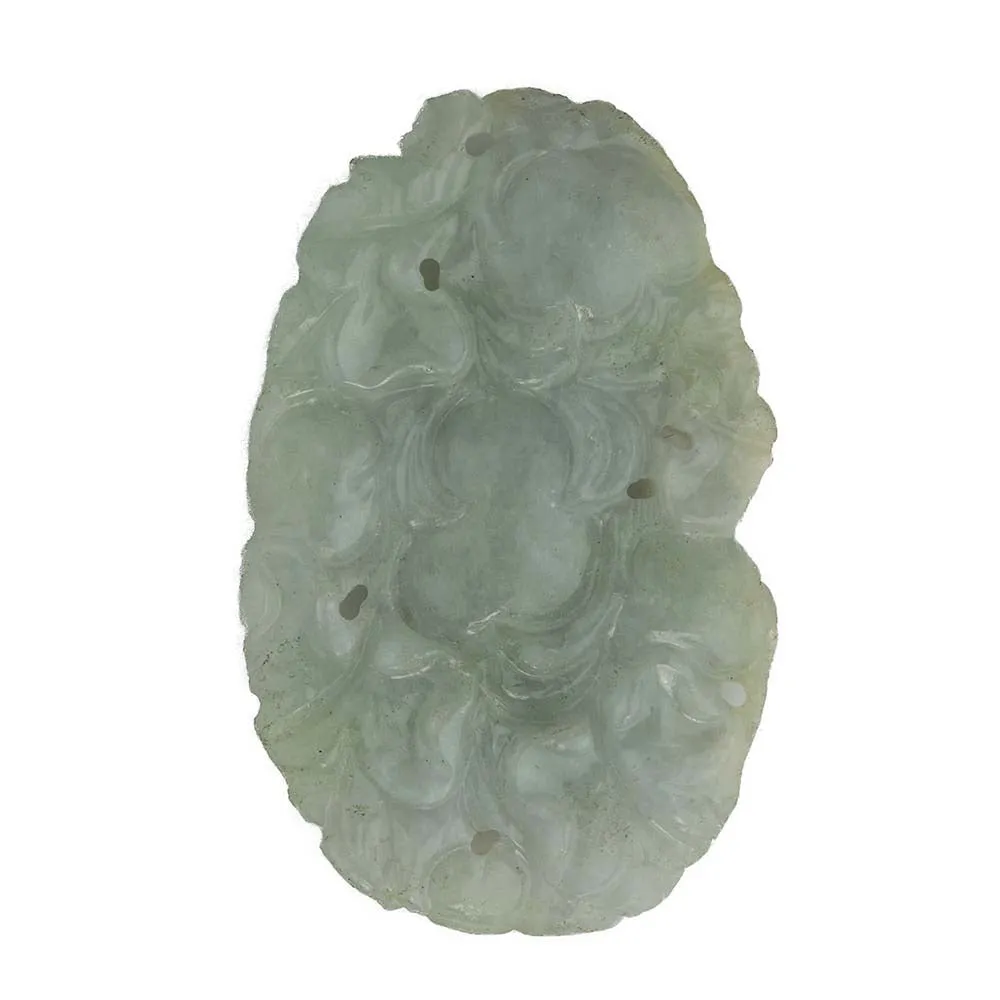 Vintage carved jadeite pendant depicting animal head in the leaves